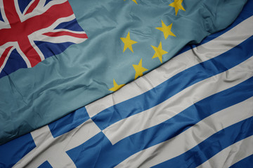 waving colorful flag of greece and national flag of Tuvalu .