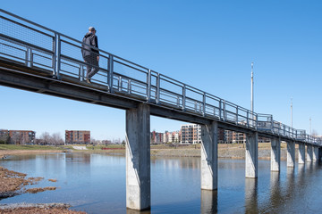 Man walking on a bridge