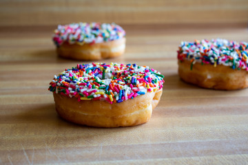 Donuts with white icing and sprinkles