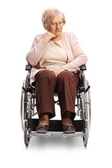 Thoughtful elderly woman sitting in a wheelchair