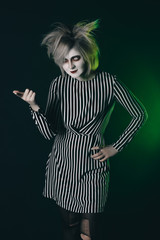 The girl in the Halloween image. Halloween party makeup and costume.
