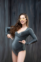 Beautiful slim pregnant woman with glasses. Healthy vision and pregnancy