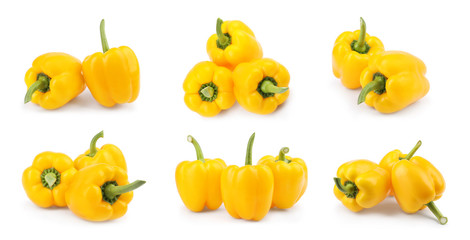Set of ripe yellow bell peppers on white background