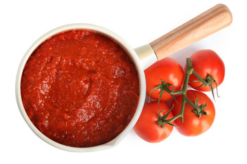 Delicious tomato sauce in pan isolated on white, top view