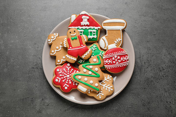 Tasty homemade Christmas cookies on grey table, top view