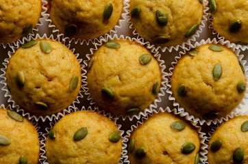 pumpkin delicious muffins on the table. horizontal top view
