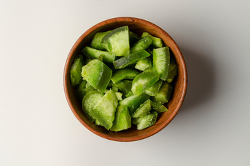 Pomelo candied fruit in wooden bowl on white background isolation