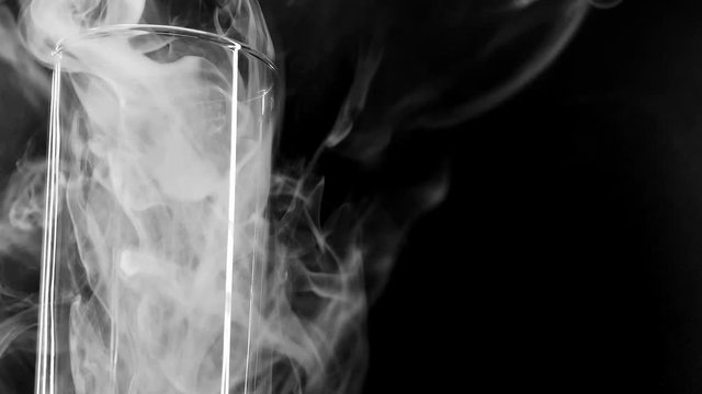 Glass Filled With Smoke. Heluin Concept. Fear. Horror. Something In Smoke. Smoke VFX Elements. Magic Halloween. Smoke On A Black Background 