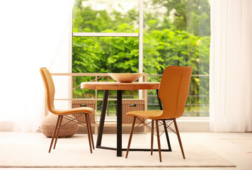 Fototapeta na wymiar Modern dining room interior with table and chairs