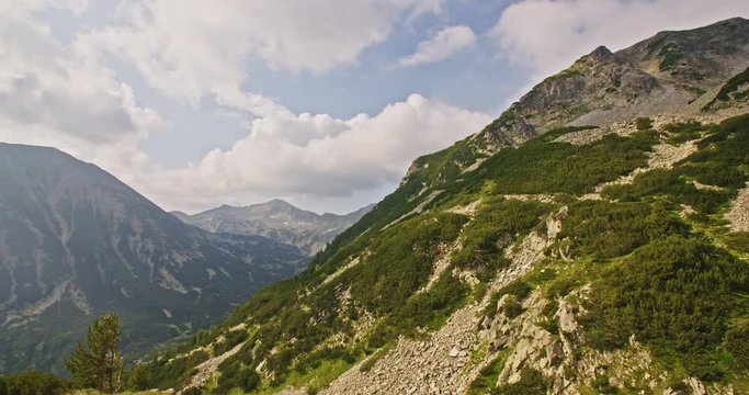 Timelapse of clouds passing over a mountainous summer landscape in Pirin mountain, Bulgaria.