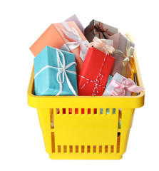 Fototapeta premium Shopping basket full of gift boxes on white background