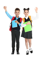 Obraz premium Happy children in school uniform on white background