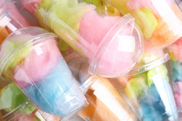 Pile of plastic cups with cotton candies, closeup