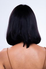 Fototapeta premium Back side view of Women to show short blonde curl Hair style before after applying hair styling, studio lighting gray background isolated, copy space for text logo