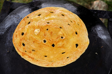 Cooking traditional Turkish borek, pide, pita or yufka bread