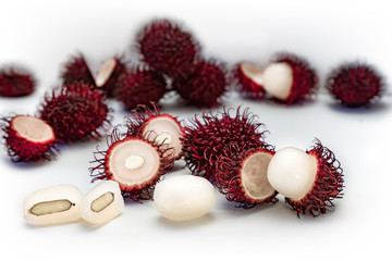 Tropical exotic rambutan fruit, whole, half, cut, seed, flesh isolated on white background