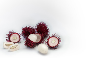 Tropical exotic rambutan fruit, whole, half, cut, seed, flesh isolated on white background