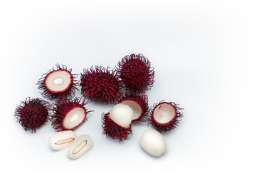 Naklejka premium Tropical exotic rambutan fruit, whole, half, cut, seed, flesh isolated on white background