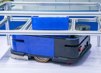 Automatic warehouse concept with drones moving inside a modern factory