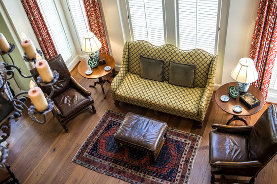 Aerial View Of A Spacious Living Room With A Lodge Cabin Style With Earth-tone Furniture And A Fireplace