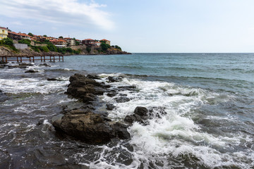 Houses, buildings and remains of the old fortress wall of the ancient seaside town of Sozopol. Bulgaria.