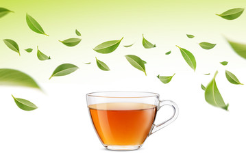 Hot cup of tea with flying green tea leaves in the air, Healthy products by organic natural ingredients concept, Empty space in studio shot