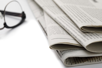 Mockup of Business Newspaper with glasses isolated on white background