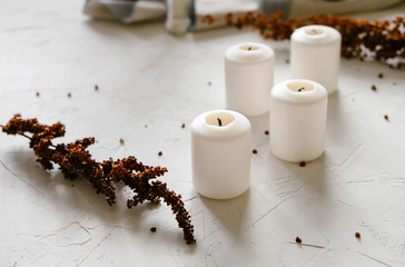 Obraz na płótnie Canvas White Candles As Decoration On The Table