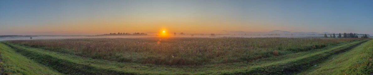 Sunrise on a foggy morning. Zavyalovsky district, Udmurt Republic, Russia.