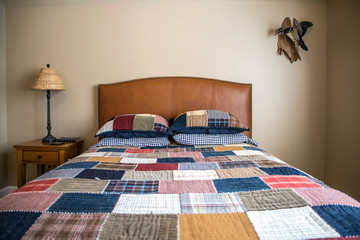 Teen traditional boy bedroom in a suburban home house with plaid comforter