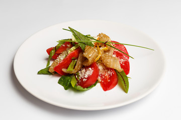 squid with a vegetables on a plate