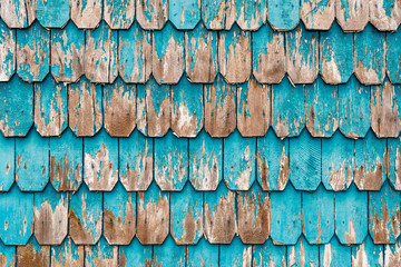 Colorful turquoise larch tree wood panel decorations used to cover the outside wall of houses in the Lake District of Chile in the cities of Puerto Montt, Puerto Varas and Chiloe island.