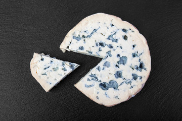 french cow's milk cheese called Fourme d'Ambert on a plate
