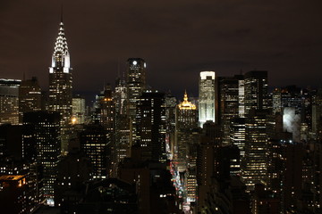 Fototapeta na wymiar New York City landscape in deep night showing these amazing city lights