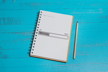 notebook with Brainstorming title on page and progress bar loading