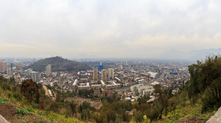 Fototapeta na wymiar Panoramic view of Santiago's pollution from San Cristobal Hill in Chile.