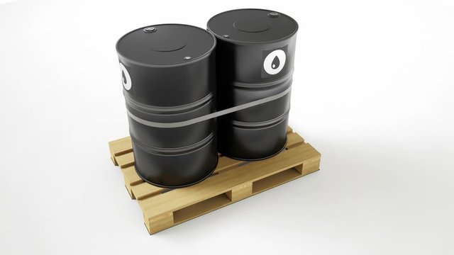 Two metal black barrels with oil symbol located on wooden pallet, isolated on white background. Barrels are strapped by tape, fillers on top. Top view, camera truck movement. 60 fps animation.