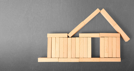 Obraz na płótnie Canvas Wooden toy house. Mortgage property home concept