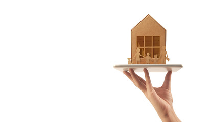 Obraz na płótnie Canvas Wooden toy house. Mortgage property home concept. Buying house for family.