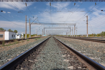 Fototapeta na wymiar the railway stretching into the horizon under the blue sky