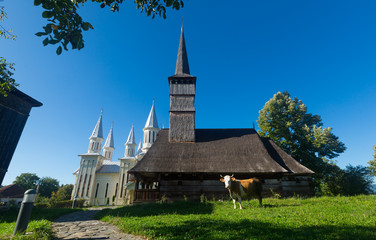 Fototapeta na wymiar Wooden and new church in Remetea Chioarului, Romania