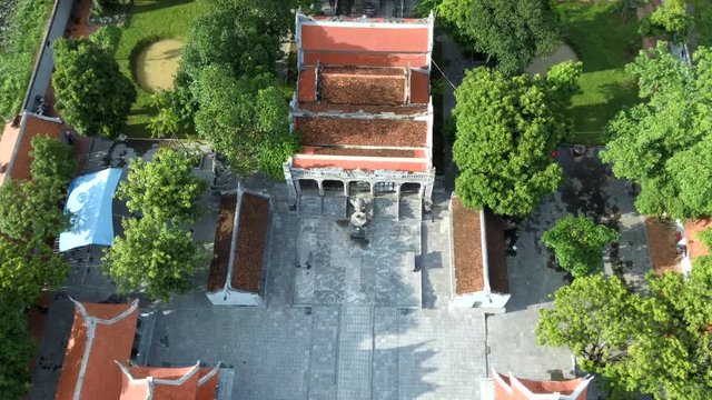 Drone footage of Tha Vi temple from above in the Unesco World Heritage site of Tam Coc, Ninh Binh, Vietnam. Can see the great architecture of the spiritual place