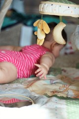 baby playing on play mat