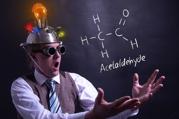 Nerd presenting handdrawn chemical formula of acetaldehyde