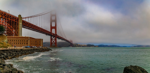 Golden Gate bridge with low fog rolling in San Francisco, California