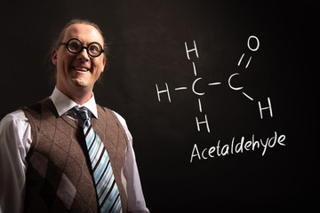 Professor presenting handdrawn chemical formula of acetaldehyde