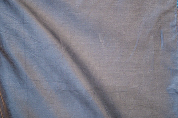 Dark grey canvas fabric texture.