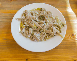 Pizzoccheri are a traditional Italian dish from the Valtellina area. Dish prepared with pasta similar to tagliatelle with melted cheese, cabbage and potatoes