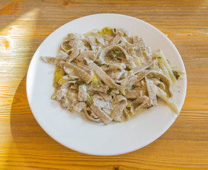 Pizzoccheri are a traditional Italian dish from the Valtellina area. Dish prepared with pasta similar to tagliatelle with melted cheese, cabbage and potatoes