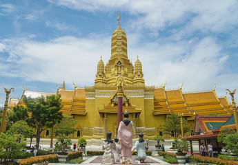 Naklejka premium Samutprakarn / Thailand - August 12 2019: beautiful golden temple with Buddha statue at birth